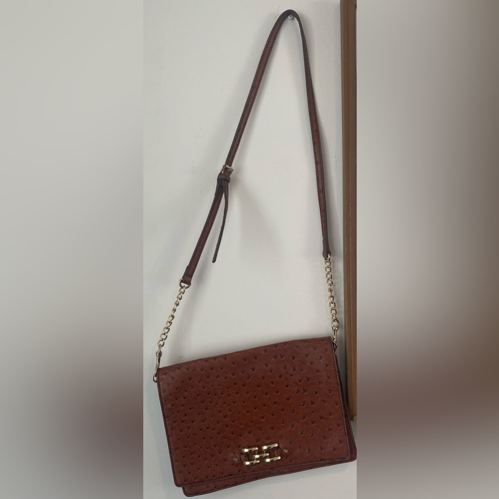Brown crossbody pocketbook with gray print inside